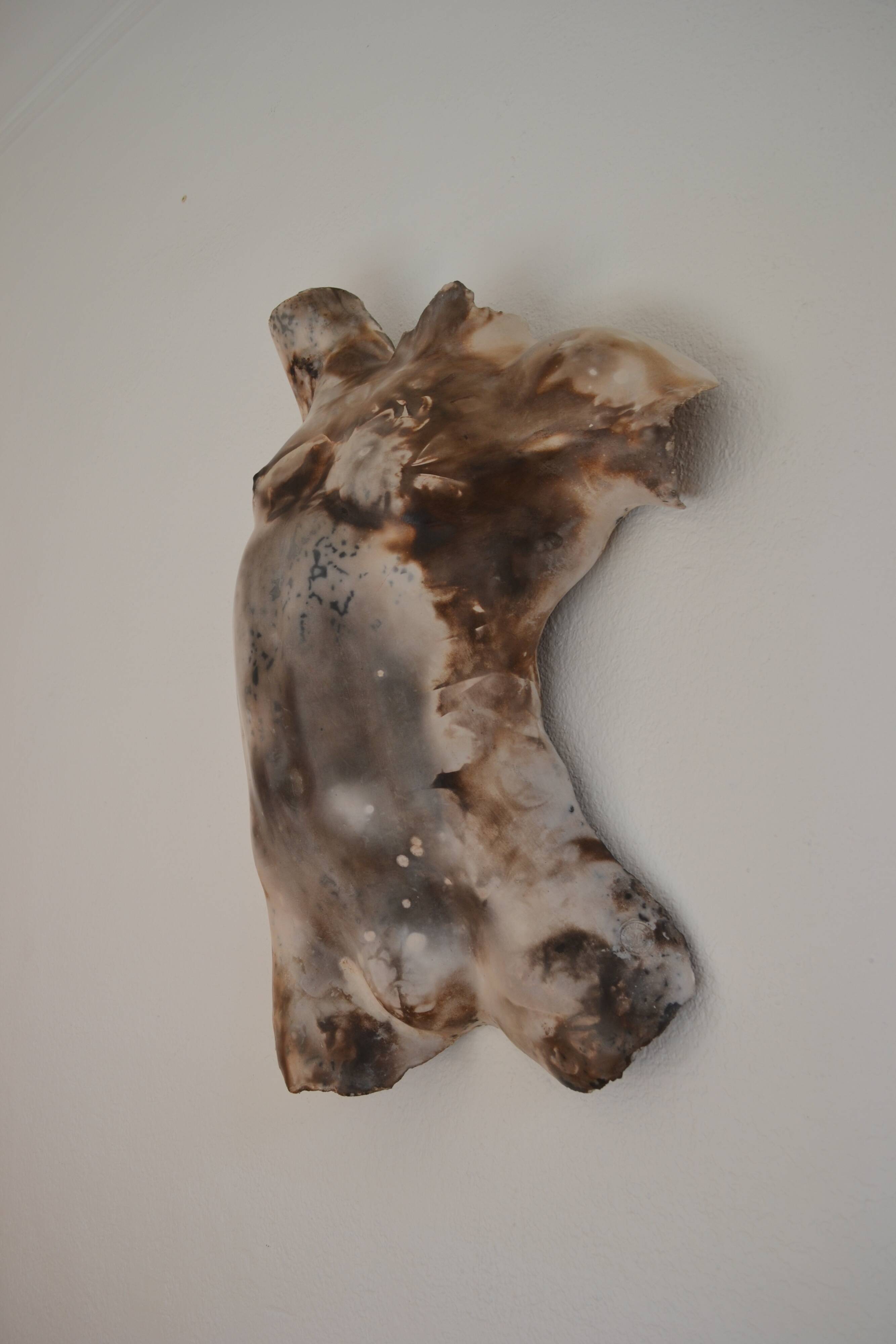 Male torso sculpture by patinated casting, signed to be identified.