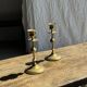 Pair of gilded candlesticks with engraved flower garland motifs H22