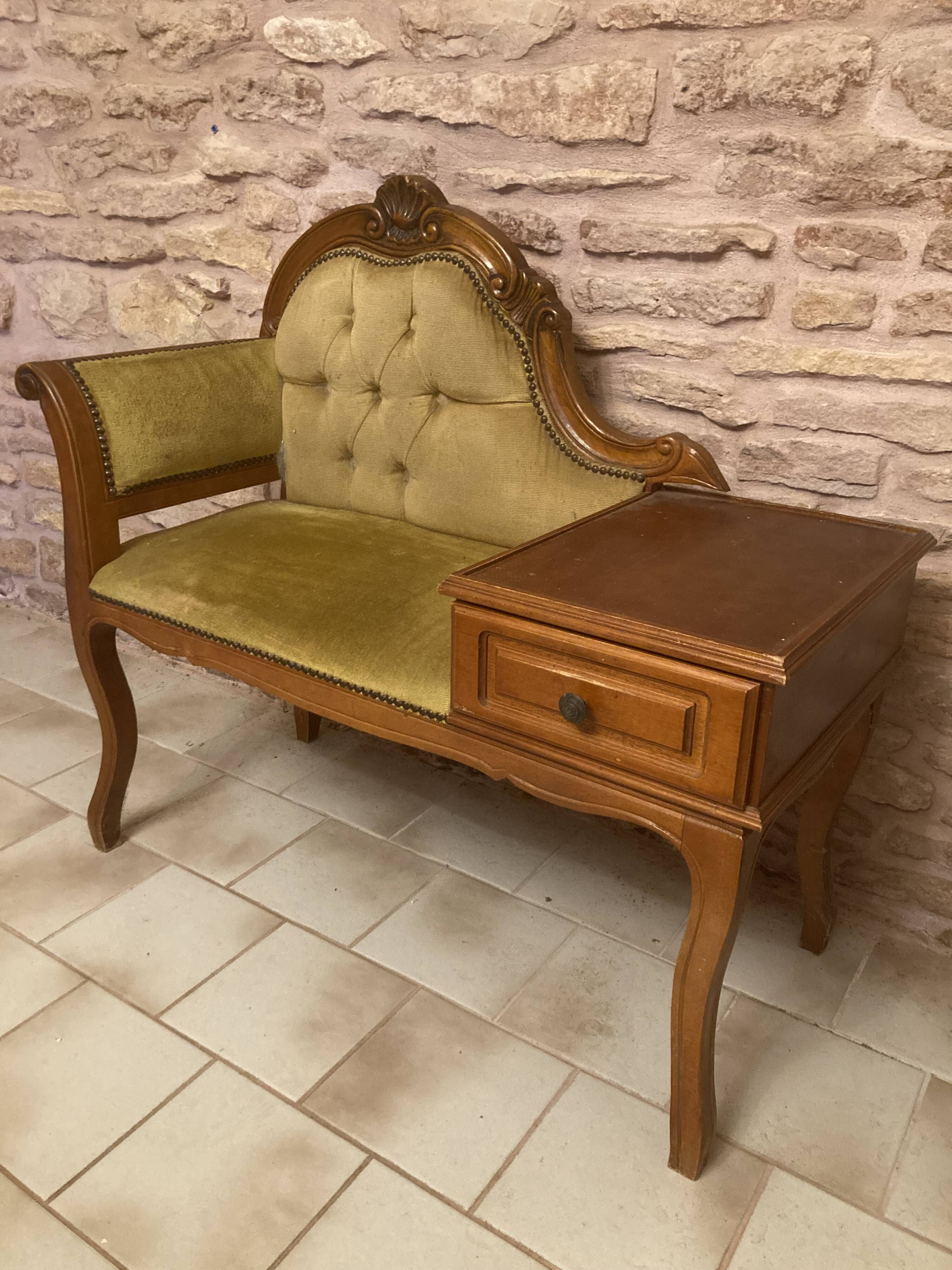 Telephone cabinet with seat