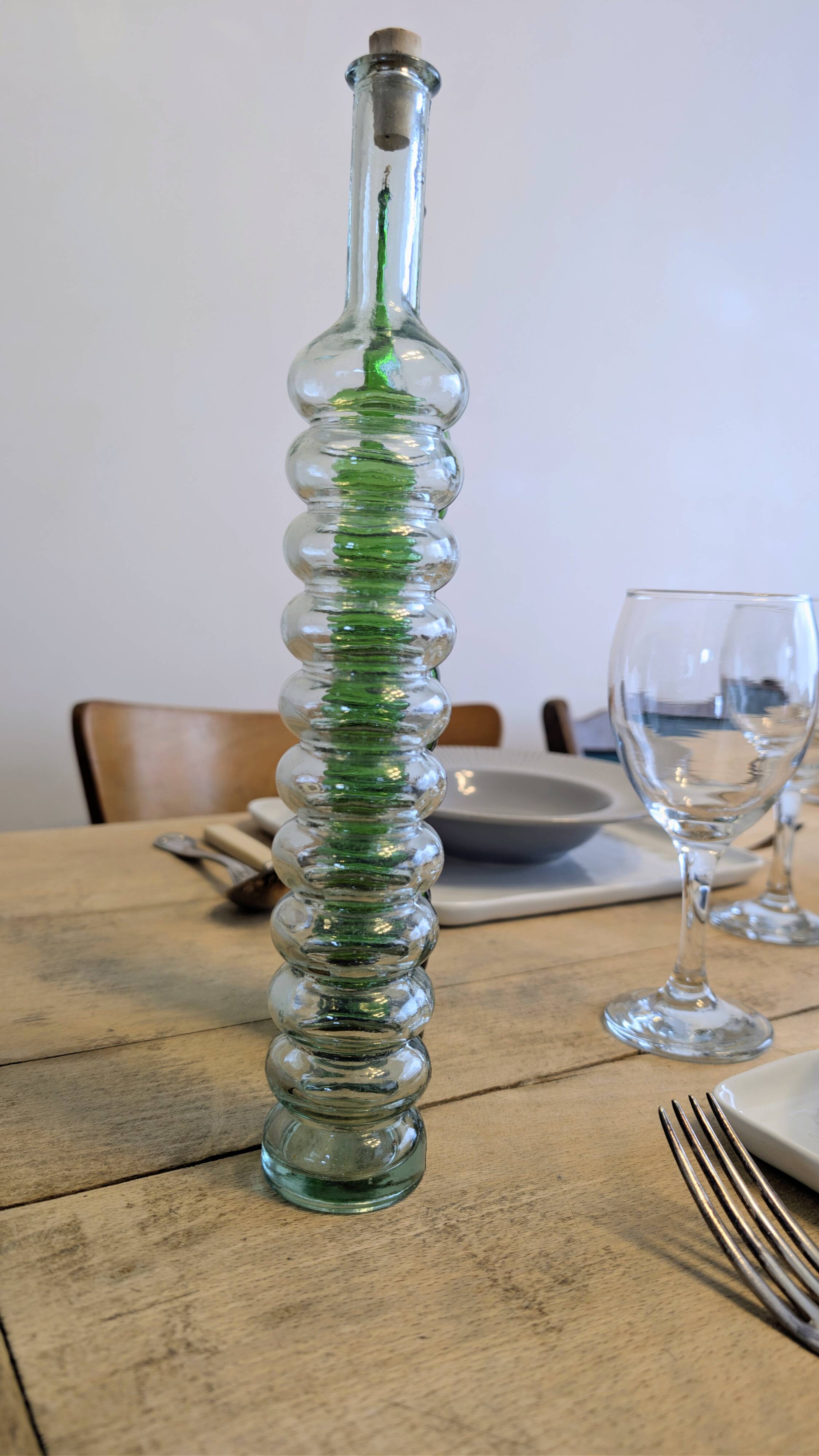 Pair of vintage ribbed blown glass bottles with cork stoppers.