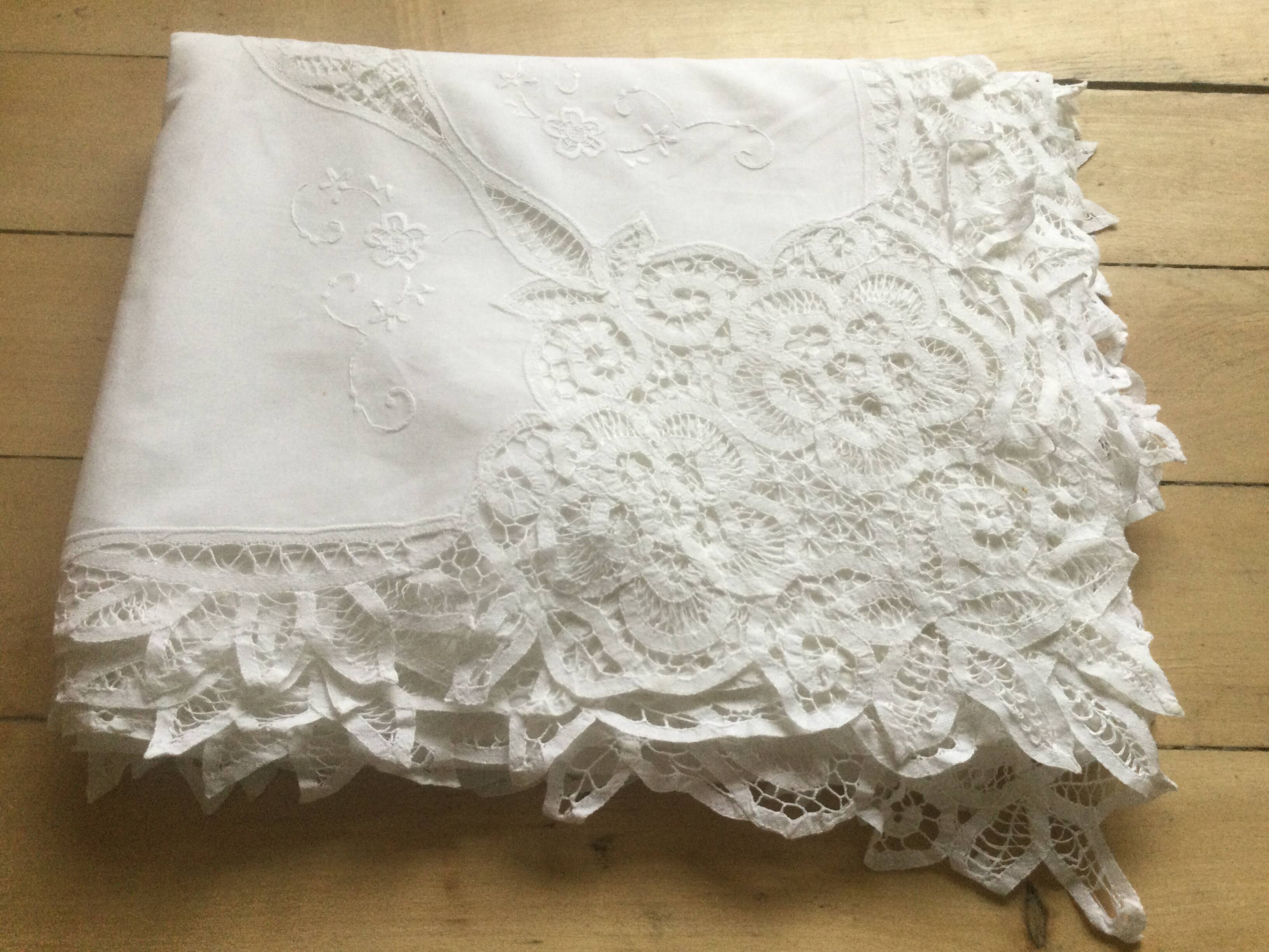 Embroidered white tablecloth and lace