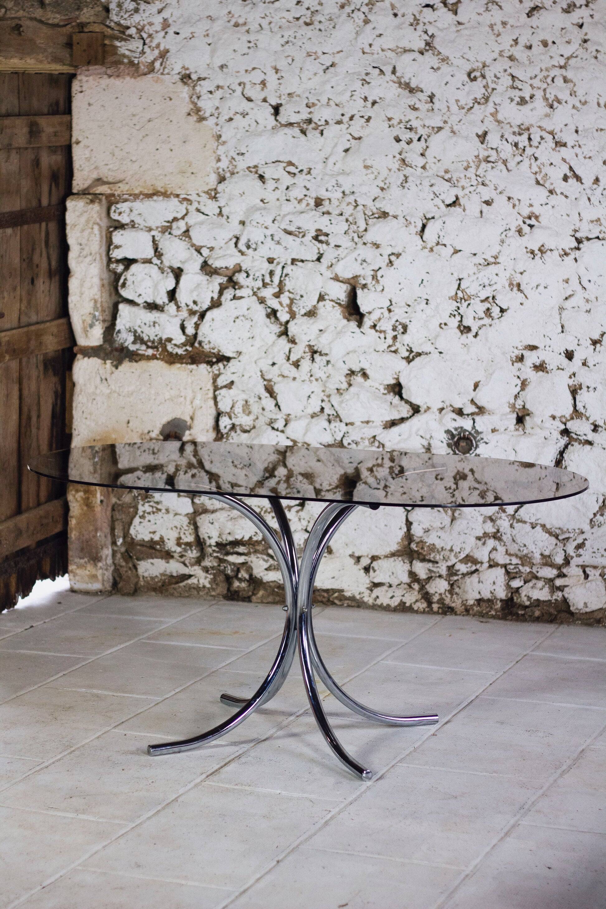 Oval dining table in chrome and smoked glass, 1970.