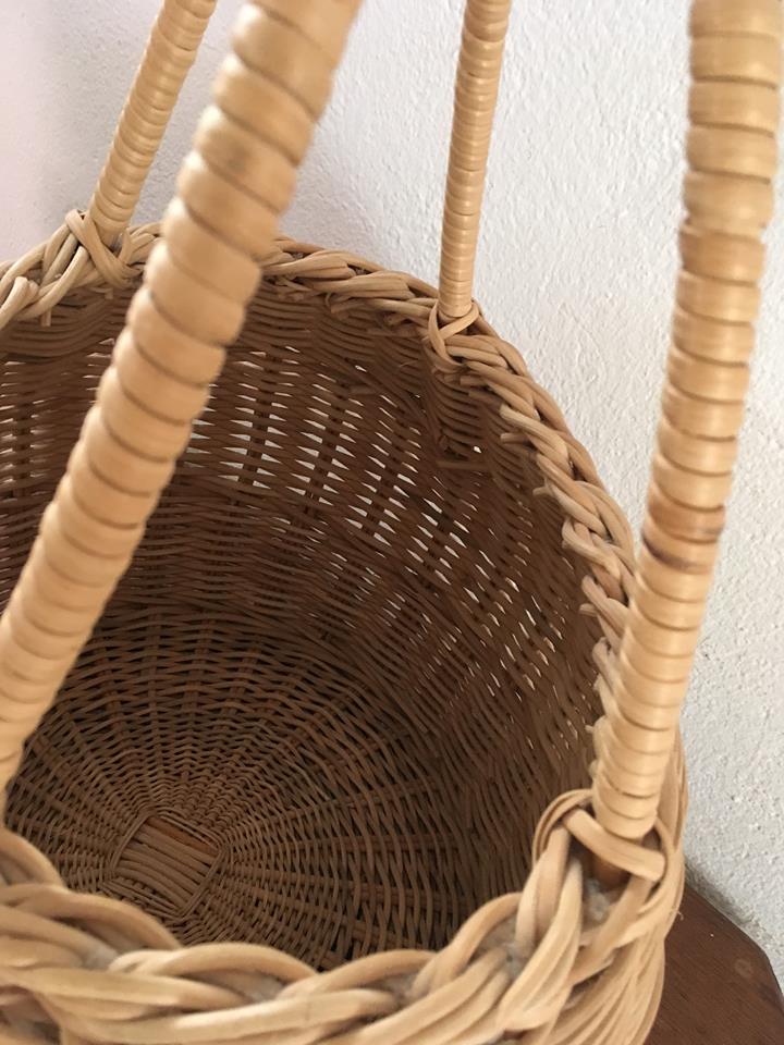 Round basket Wicker braided with two handles.