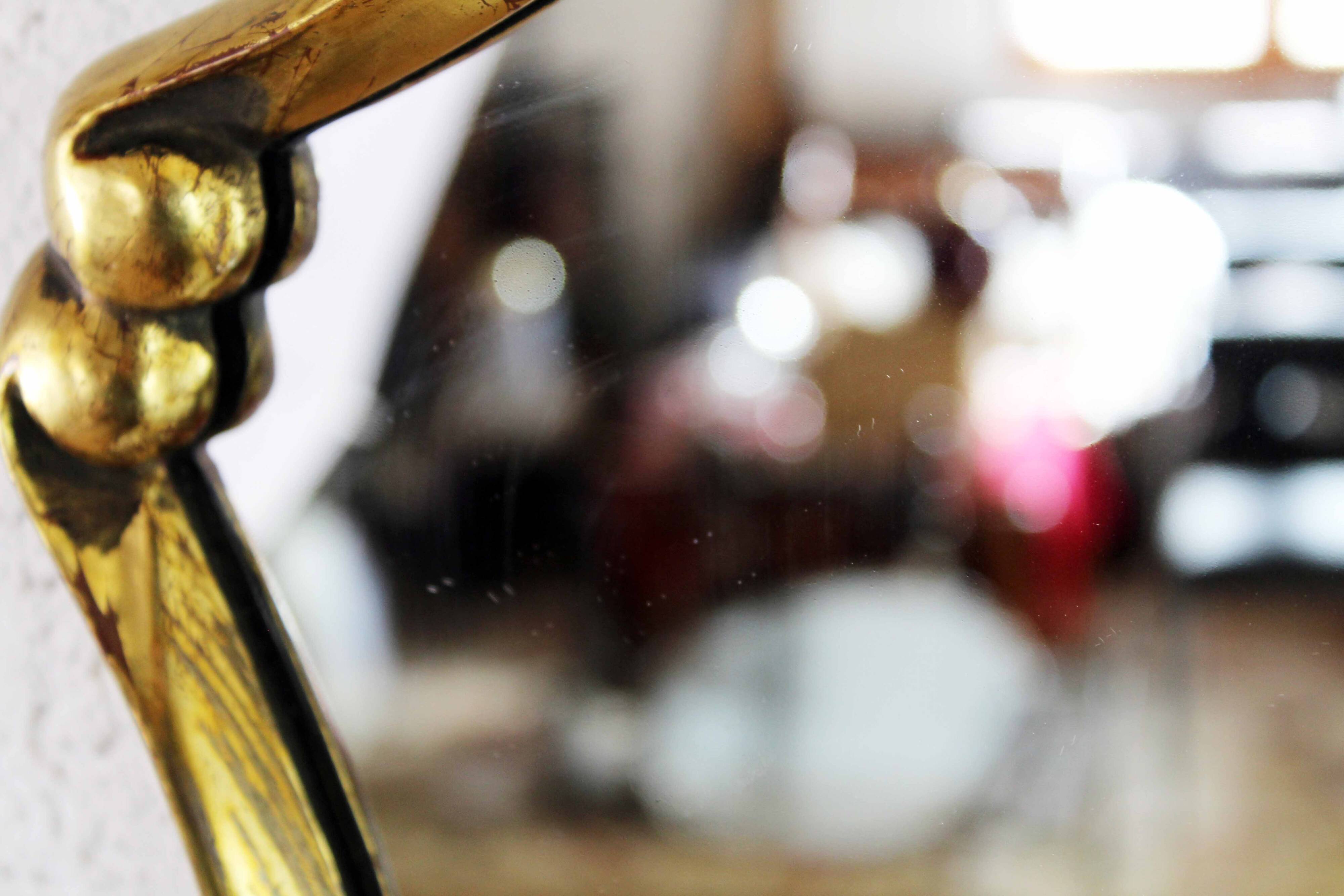Mirror in gilded wood with leaf