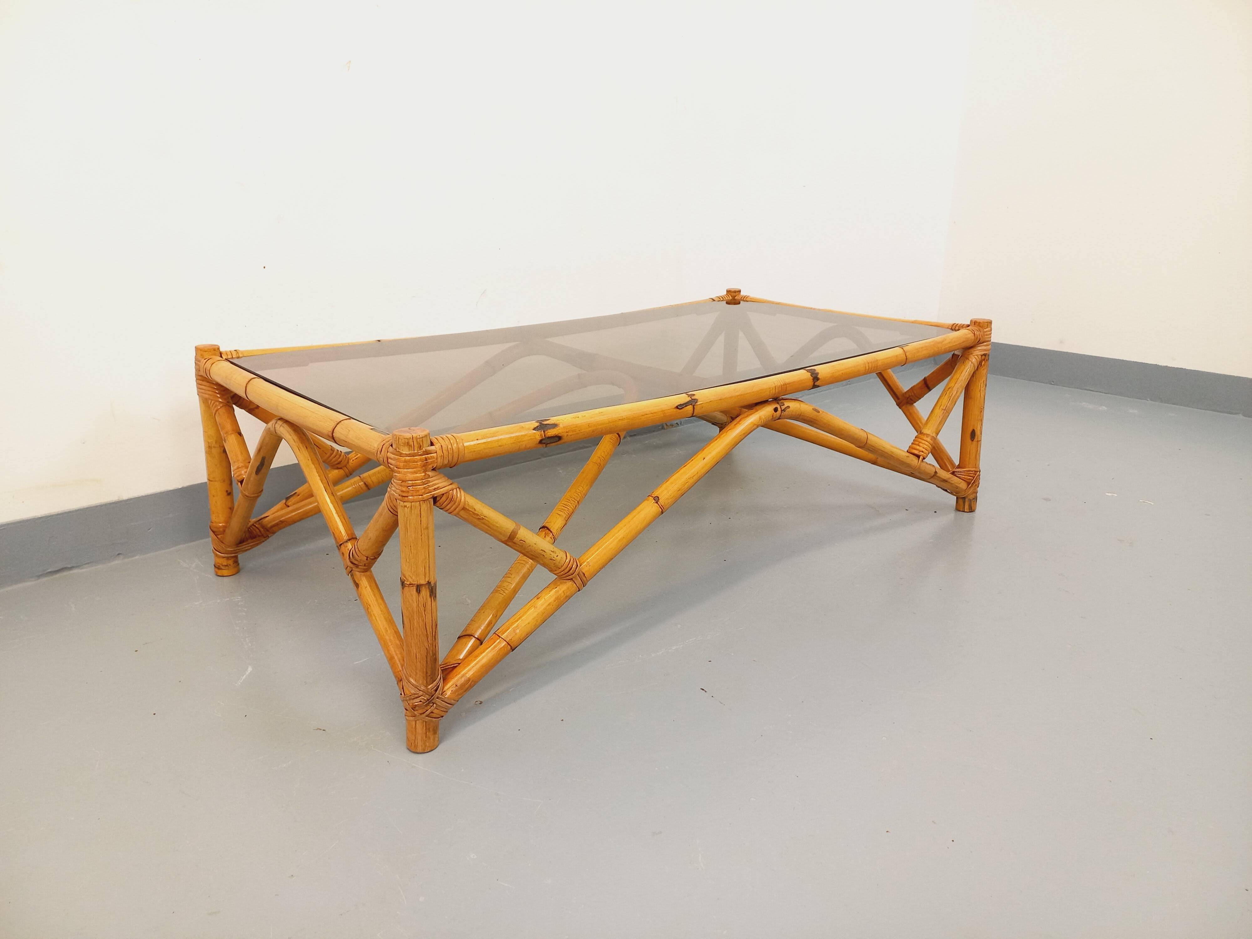 Vintage rectangular coffee table in rattan and smoked glass from the 1970s.