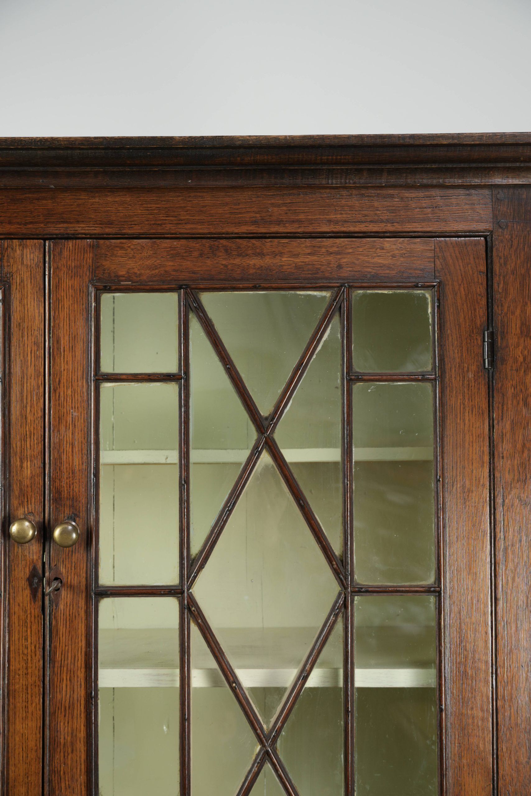 Antique 18th-century Welsh/English oak bookcase/buffet with original glass