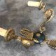 Antique bronze wall light with arm decorated with swans and palmettes in the Empire style