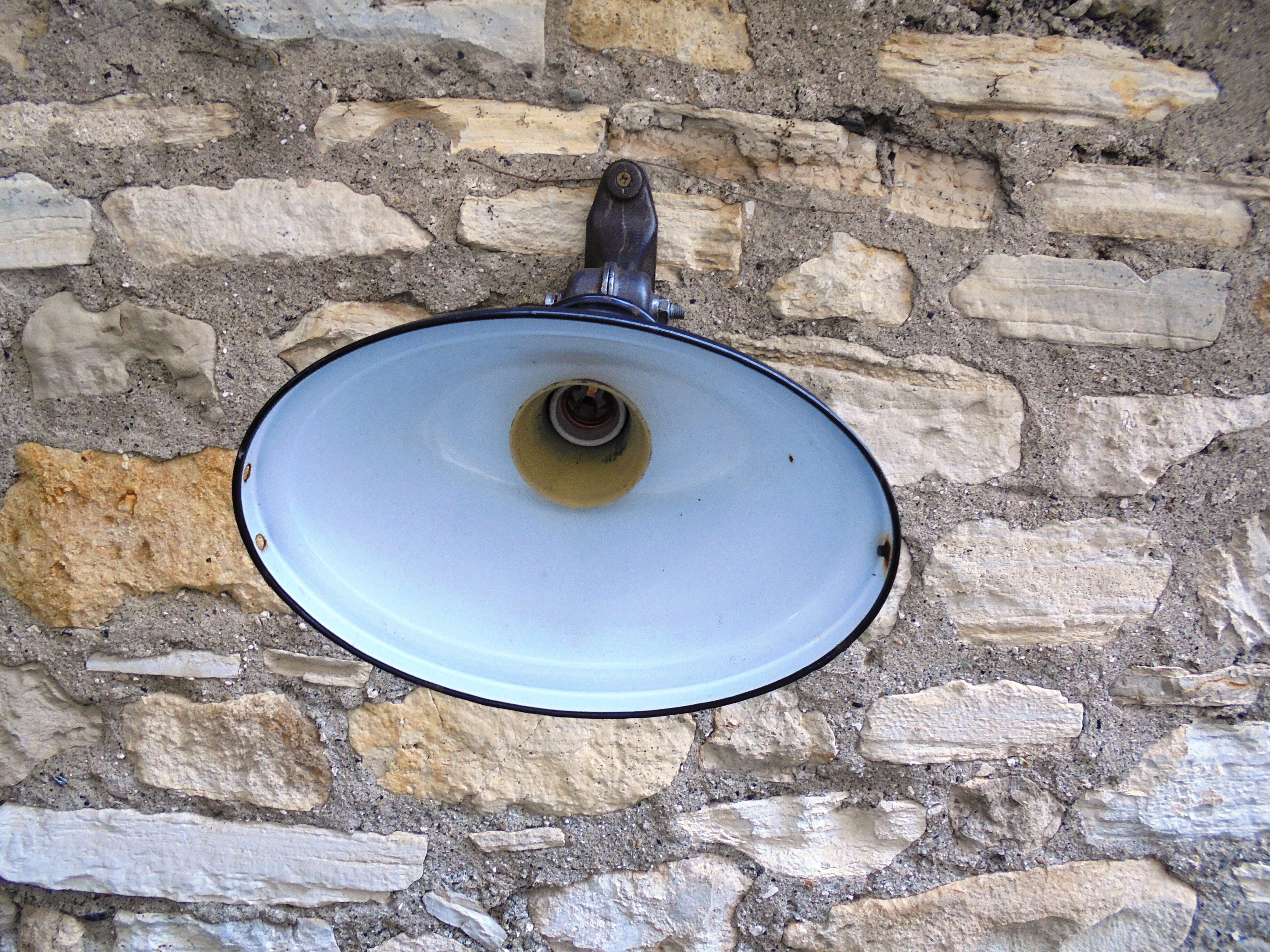 Antique cast iron and enamel wall lamp from the 1930s