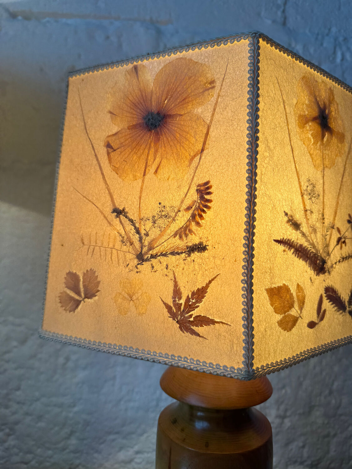 Turned wood lamp with a herbarium lampshade from the 1970s.
