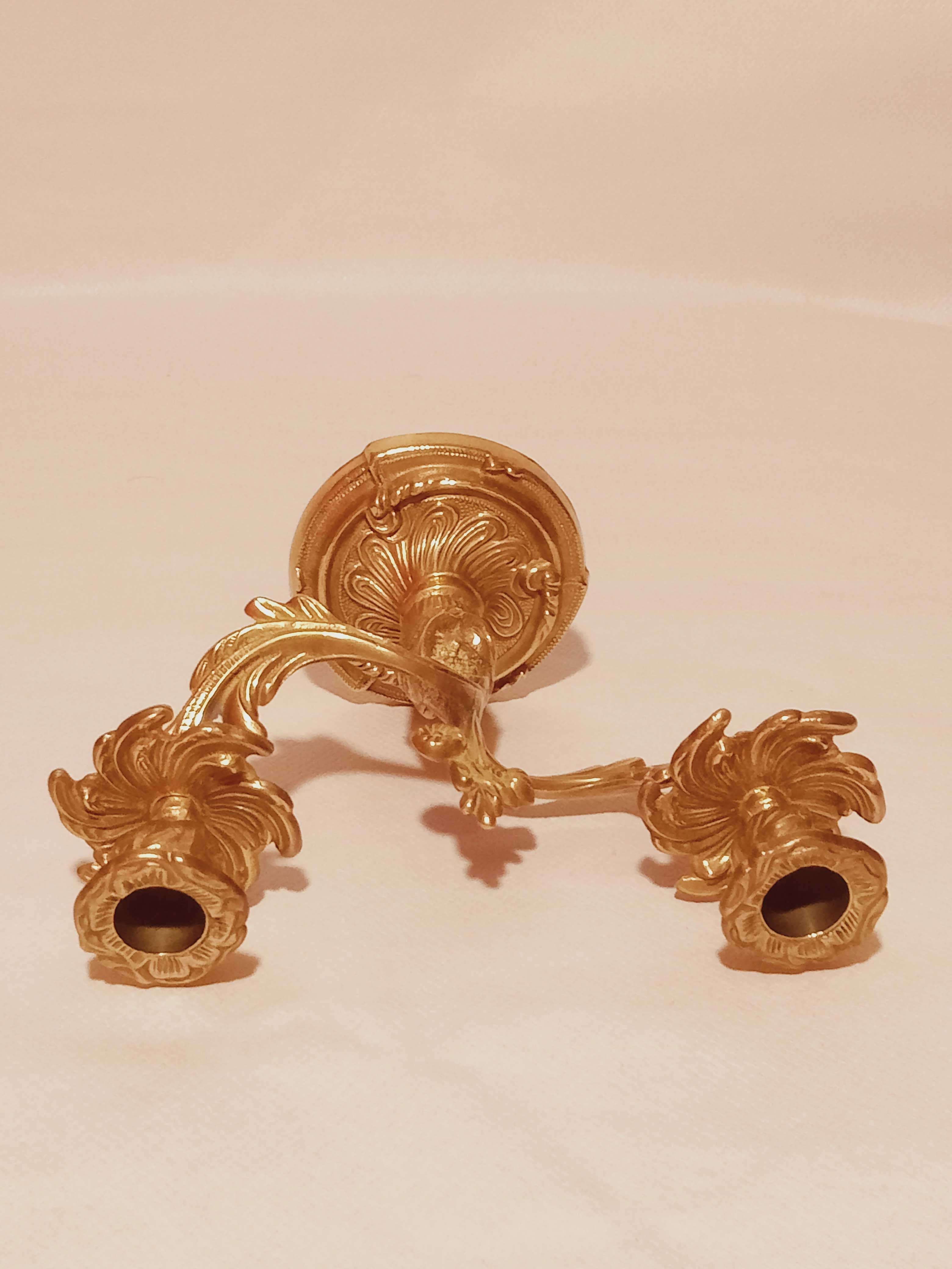 Old candle holder in gilded bronze