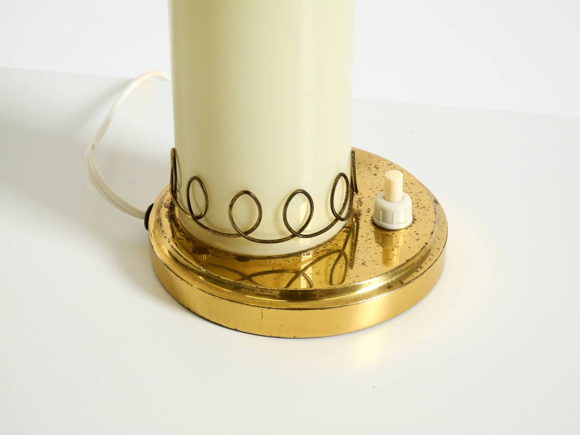 A beautiful, rare 1950s brass table lamp with one opal glass shade adorned