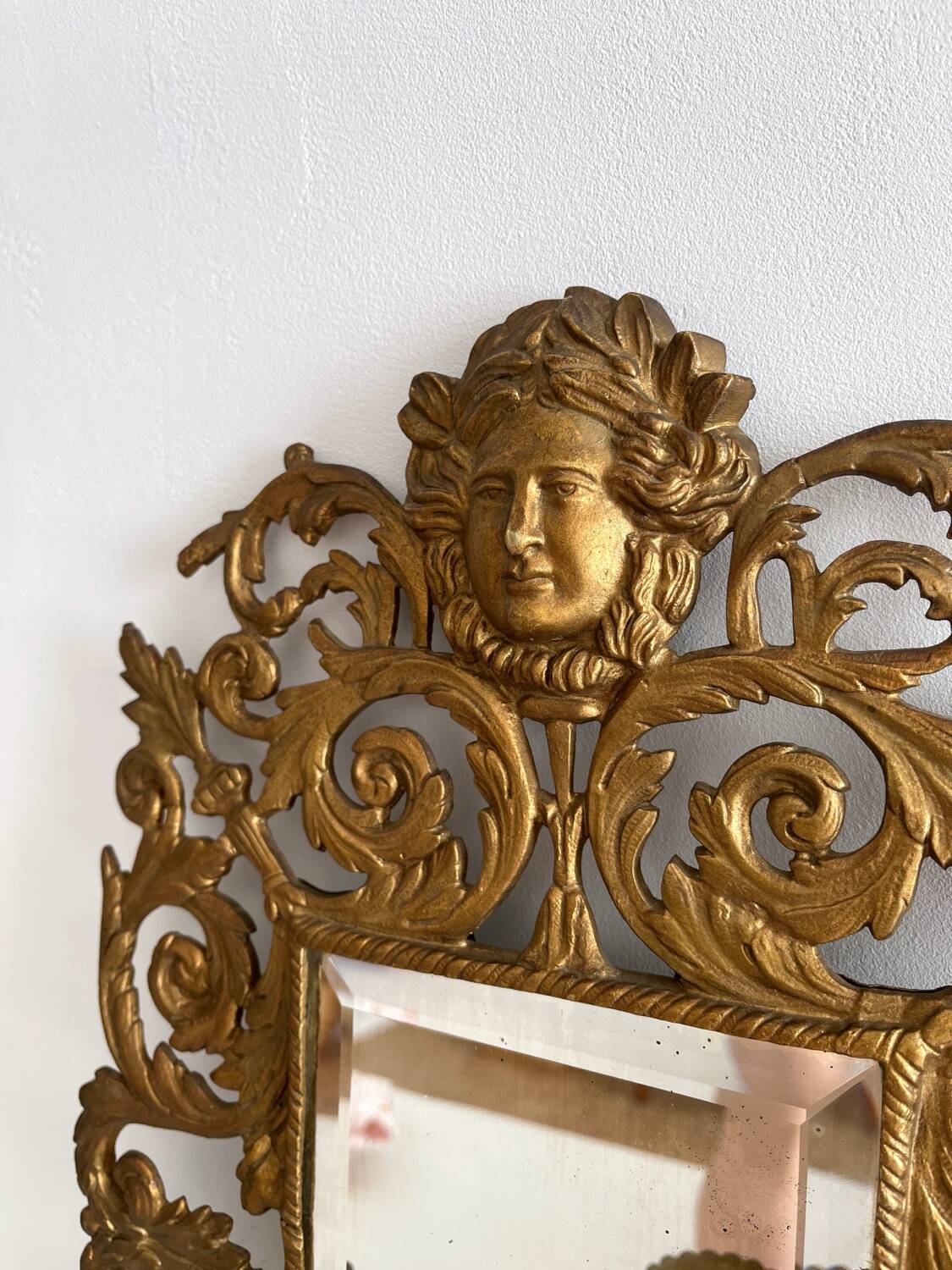 Bevelled mirror wall sconce in gilded bronze with 3 candle holders.