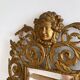 Bevelled mirror wall sconce in gilded bronze with 3 candle holders.