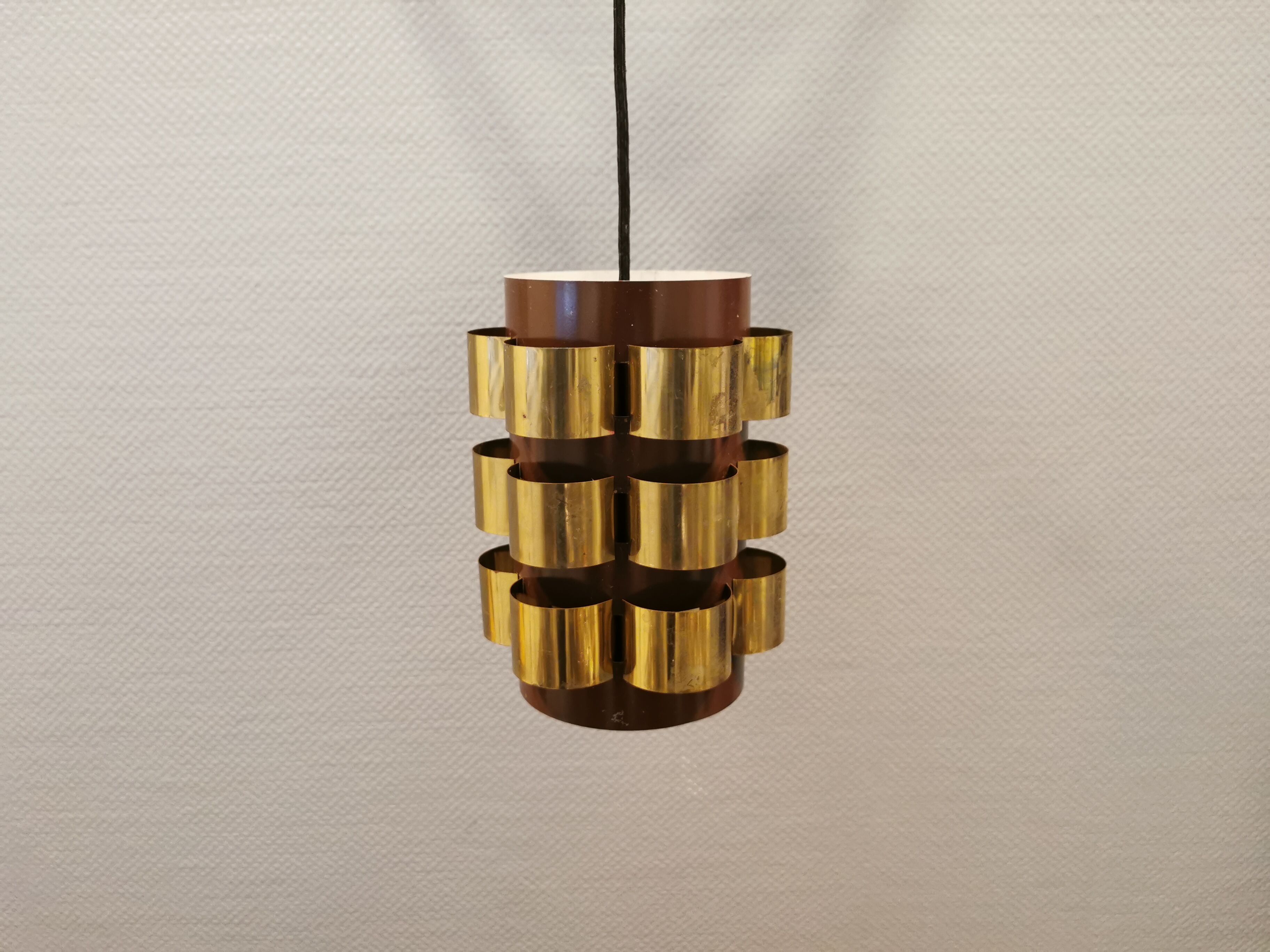 Danish hanging lamp from the 70s, in thin cut metal.