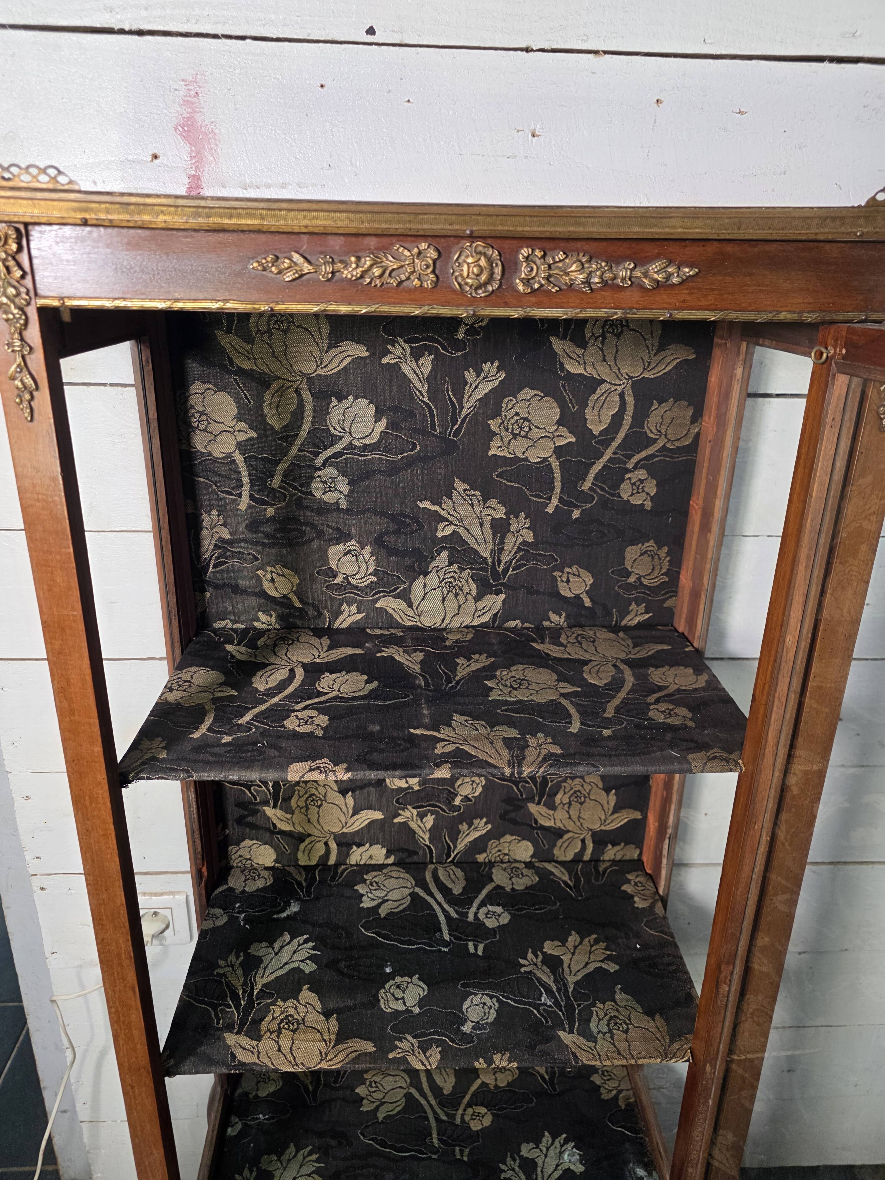 Antique library in Louis XV style made of mahogany.
