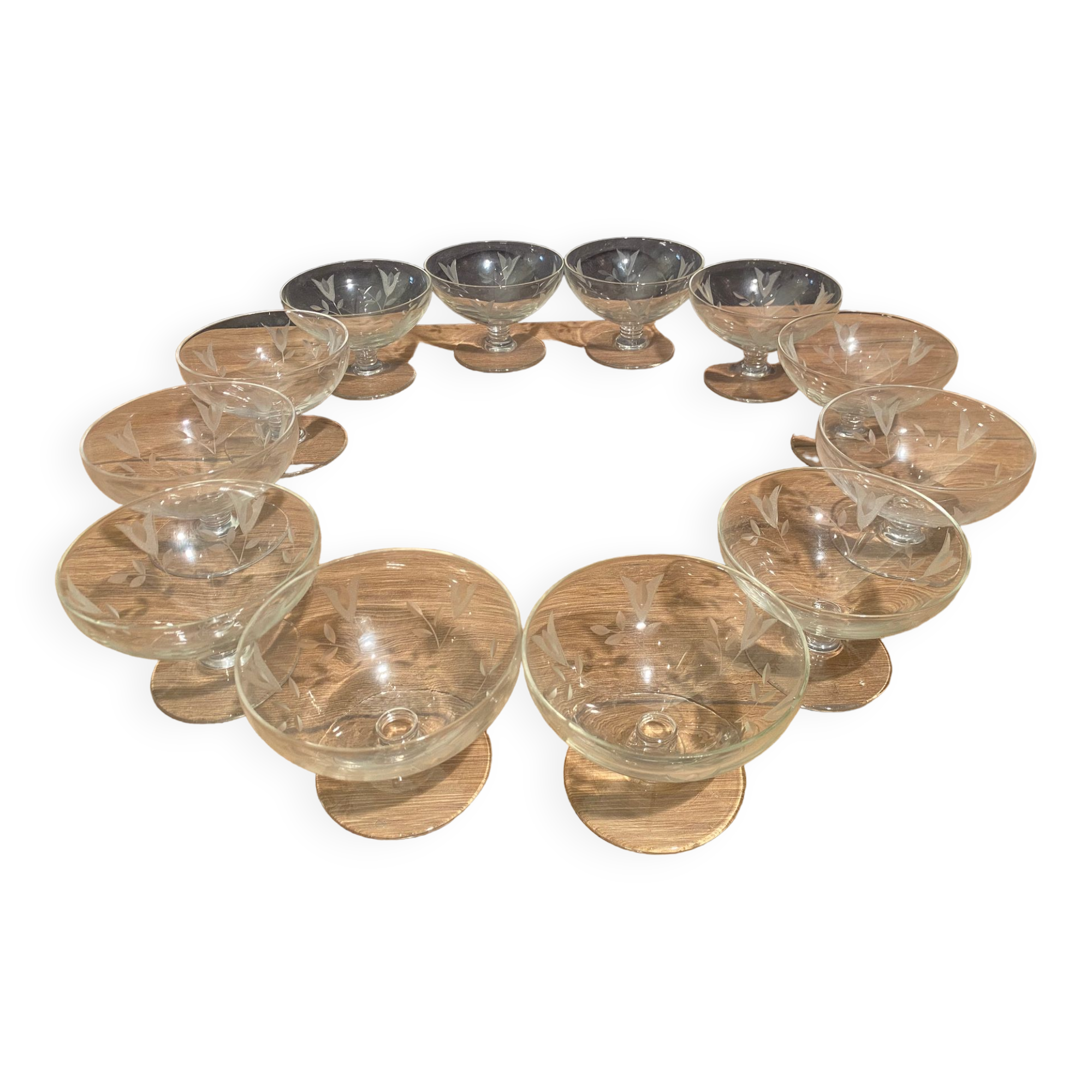 Suite of 12 champagne glasses in cut glass with floral decoration