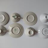 Set of mismatched fine porcelain cups signed with saucer