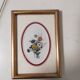Framed antique botanical engraving with gilded wall frame