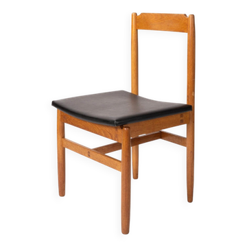Oak chair with a black leather seat made in the 1960s