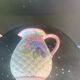 Glazed ceramic slip jug with vintage basket and fruit motif