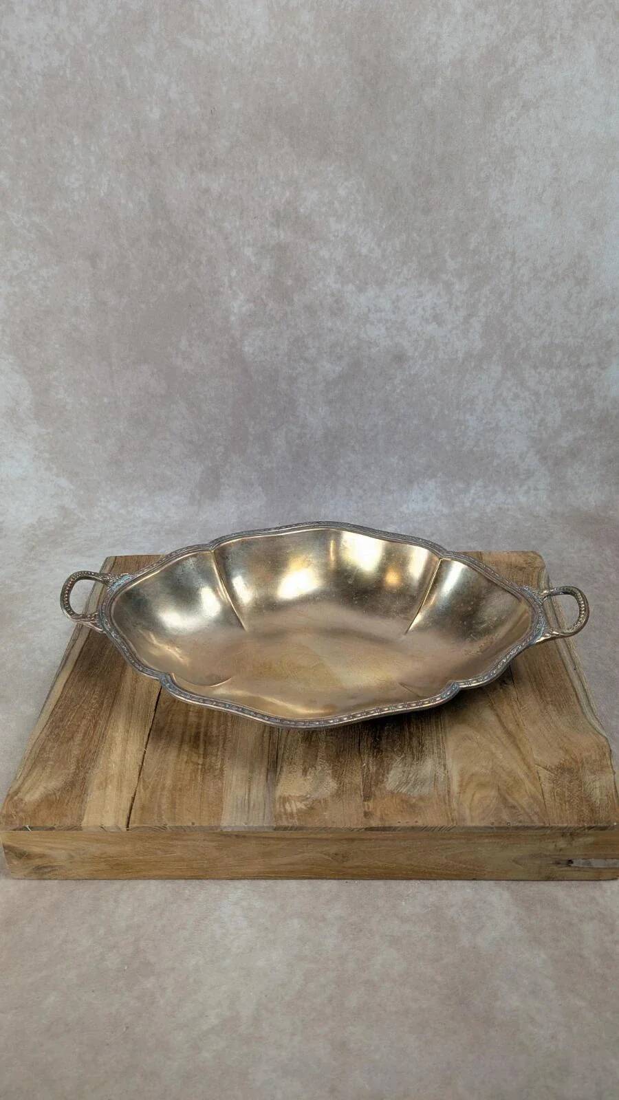 Antique oval silver-plated copper tray with handles.