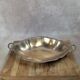 Antique oval silver-plated copper tray with handles.