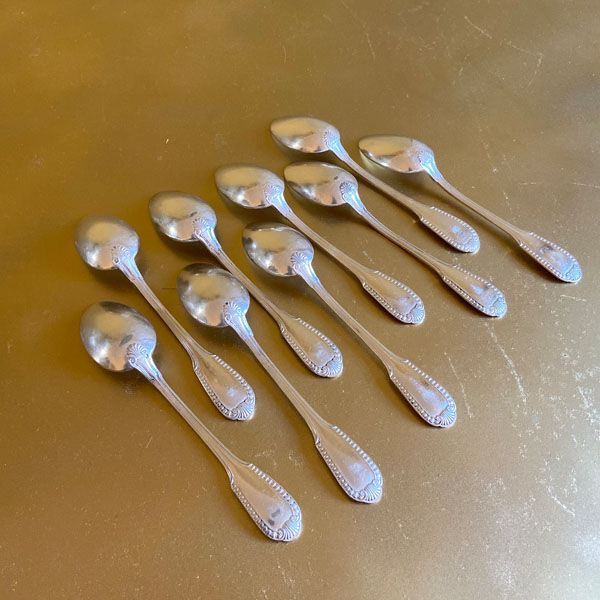 Series of 9 silver metal dessert spoons, Boulenger
