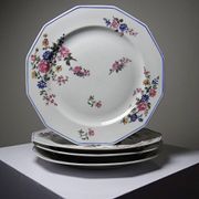 4 flat plates by Bernardaud, Limoges porcelain, floral decoration from the 1920s to 1950s.