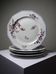 4 flat plates by Bernardaud, Limoges porcelain, floral decoration from the 1920s to 1950s.