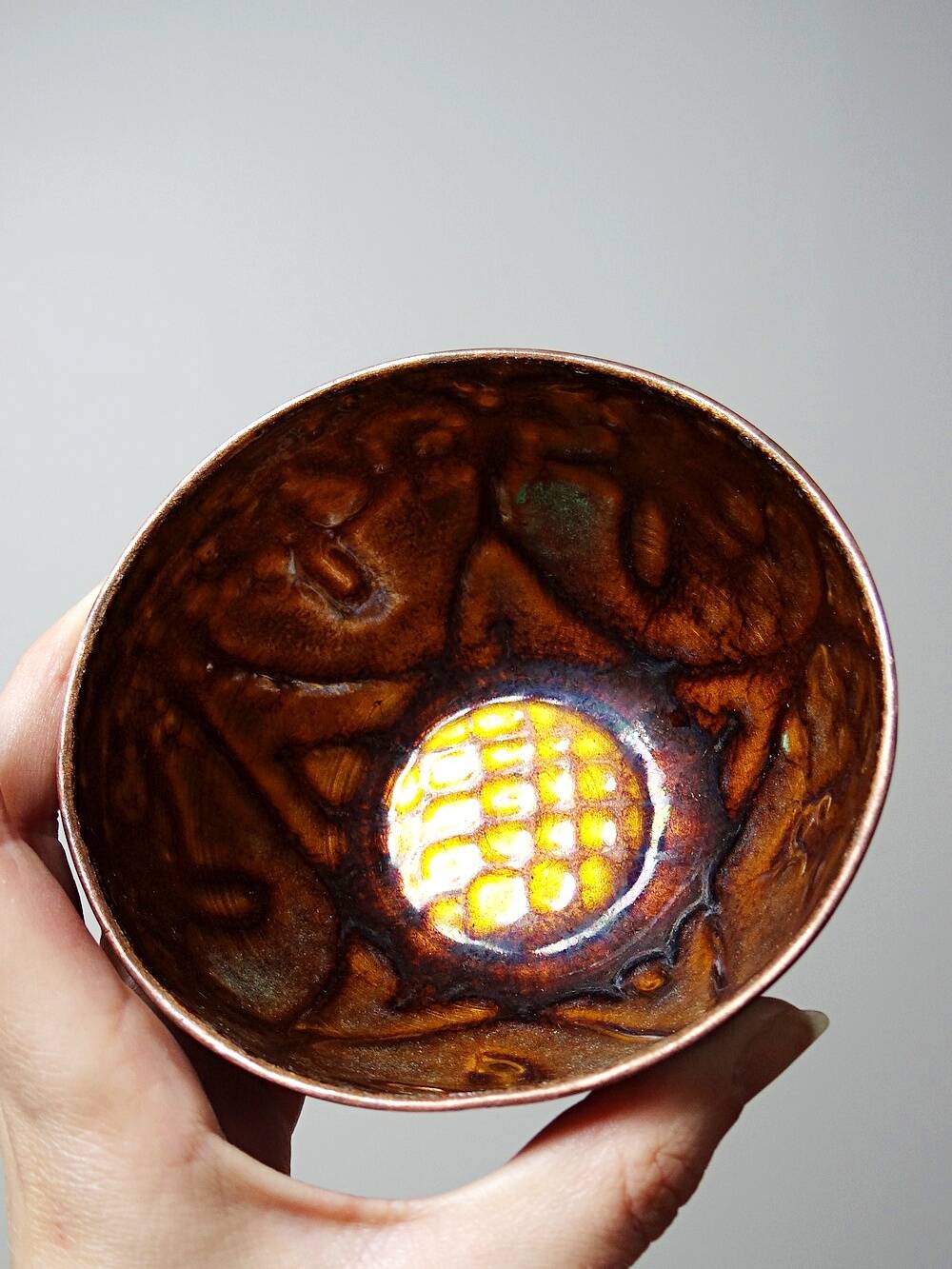 Pair of vintage hand-crafted blue and copper enamelled bowls.