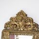 Antique French mirror in repoussé brass with a 19th-century pediment (60*34 cm)