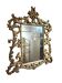 Miroir mural en bois doré décor floral