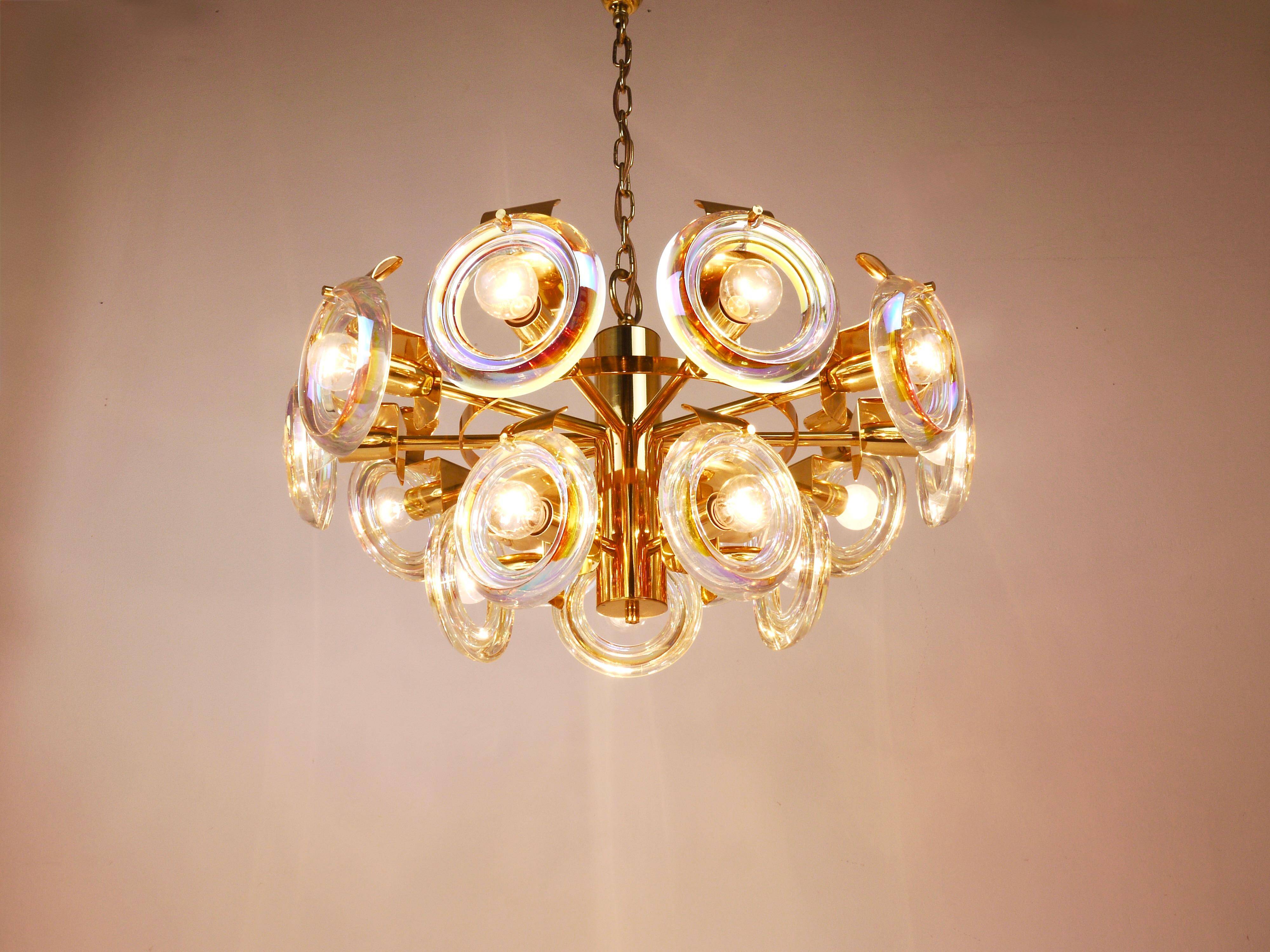Large brass chandelier by Oscar Torlasco, rainbow optical glass rings, Italy, 1970s.