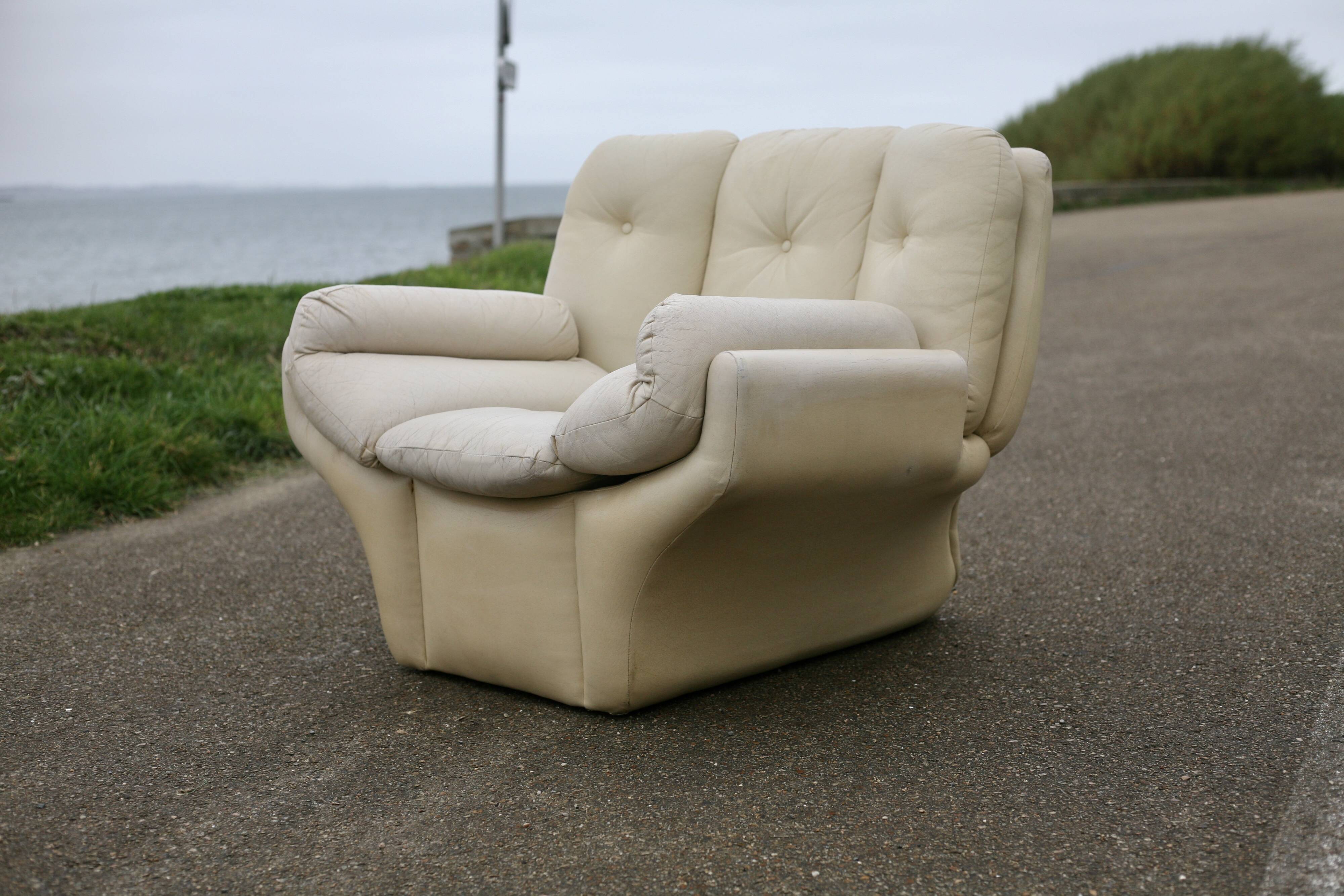 Pair of leather “space age” armchairs. Cream colour". Circa 1970.