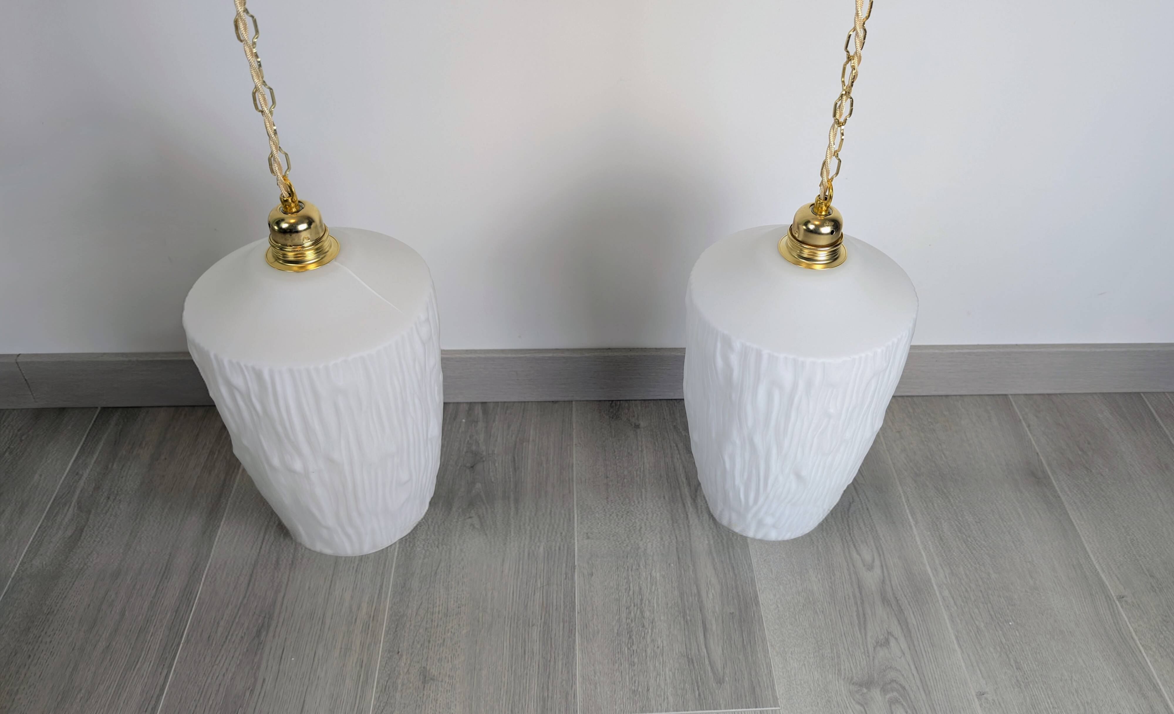 Pair of opaline pendants from the 1960s, luminous simplicity, 140 cm.