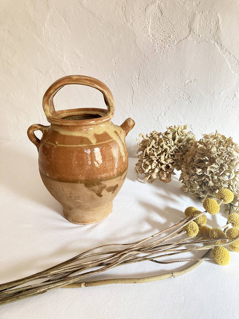 Old ochre and yellow glazed ceramic jug / goat