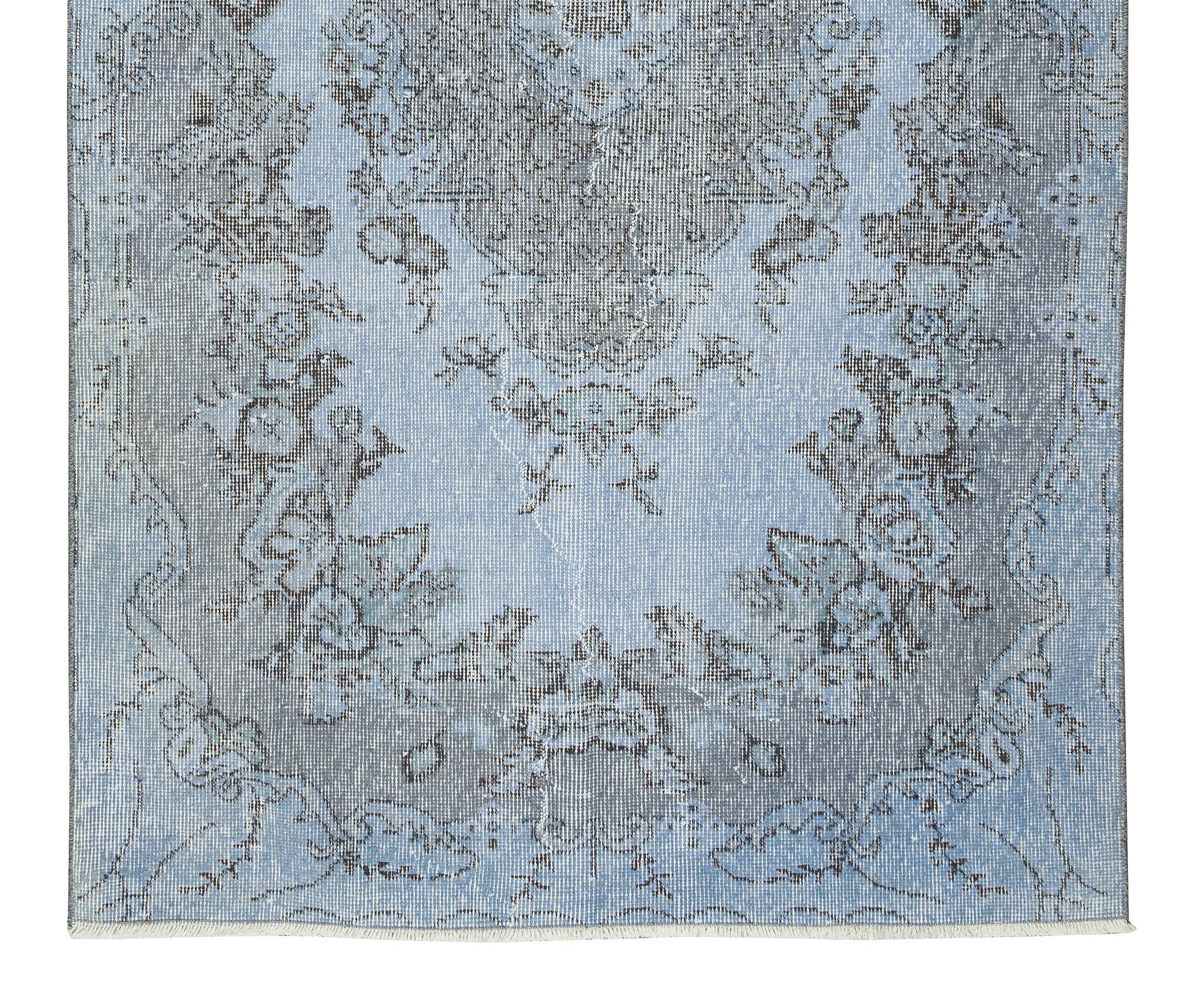 Mid-20th century hand-knotted turkish rug over-dyed in light blue. tek0394
