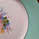 Pitted old flat earthenware plates with gold