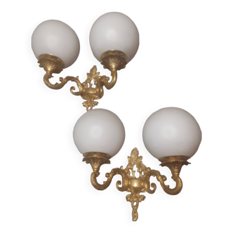 A pair of art deco style gold brass wall lights