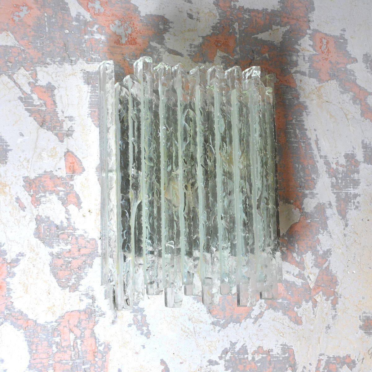 Vesta wall light in striped raw crystal with satin stainless steel support by Albano Poli for Poliarte.