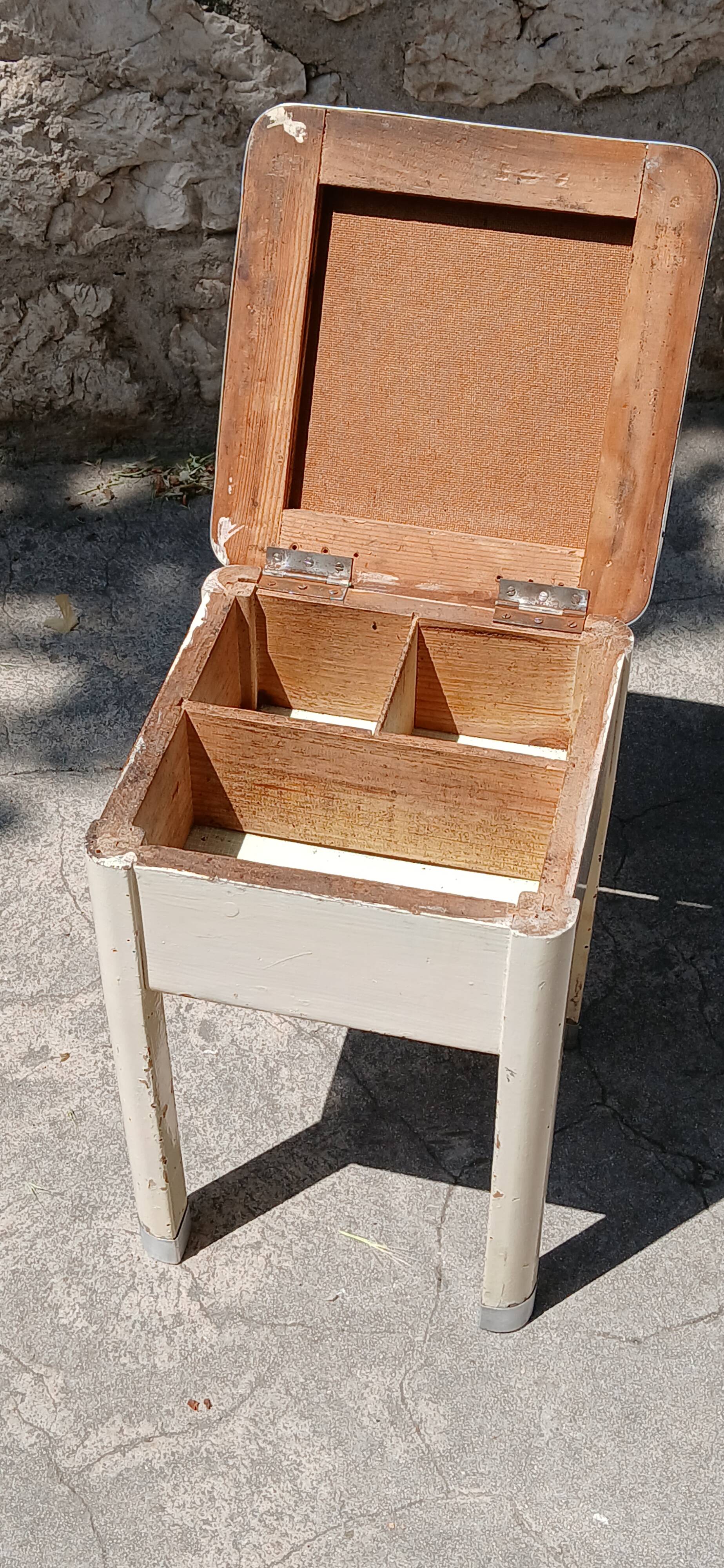 Shoe polish stool with round top and aluminum legs.