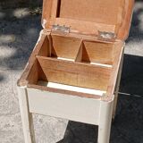 Shoe polish stool with round top and aluminum legs.