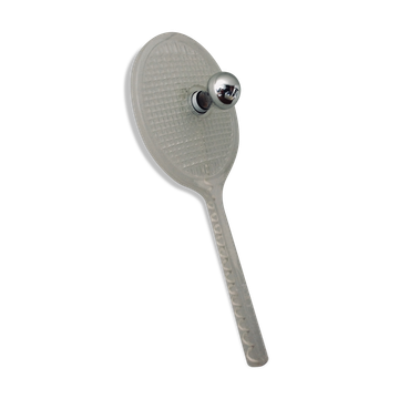 Apply tennis racket in 1980s Plexiglas