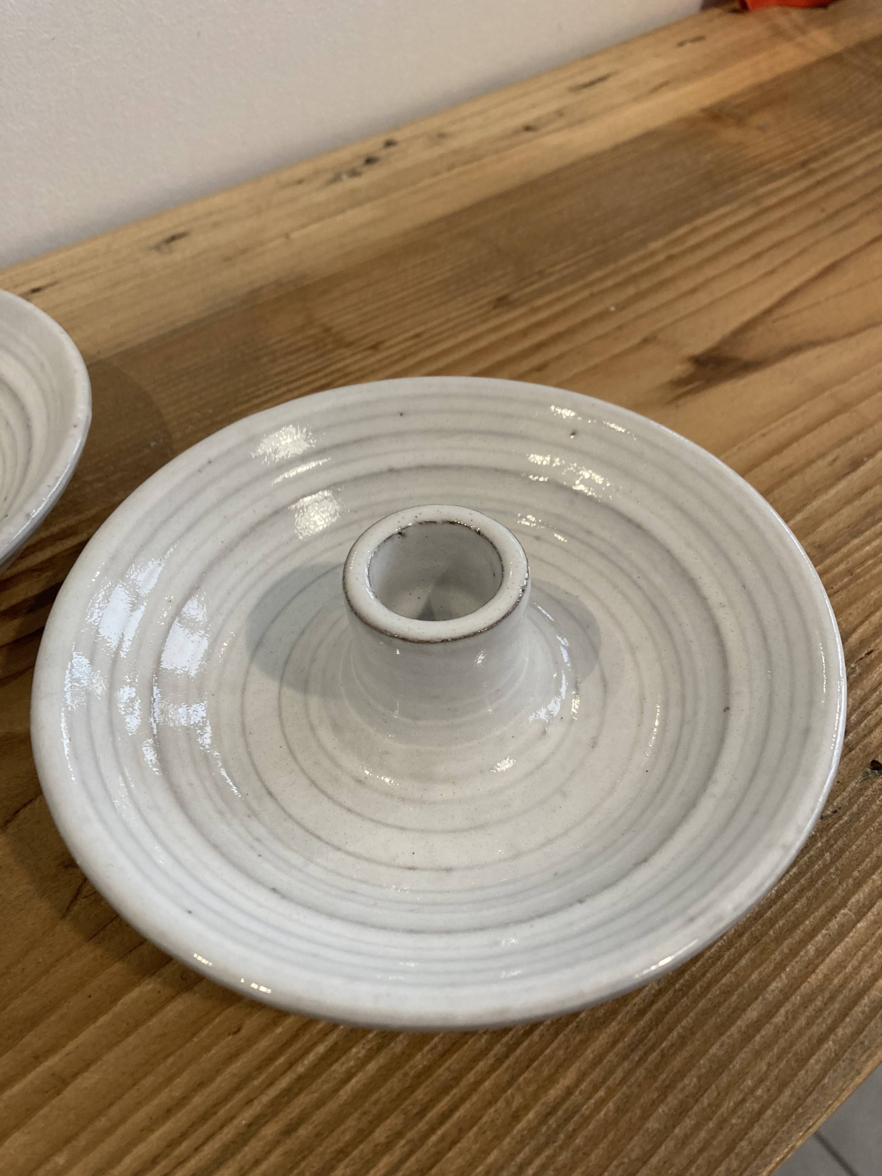 Pair of enamelled ceramic candlesticks