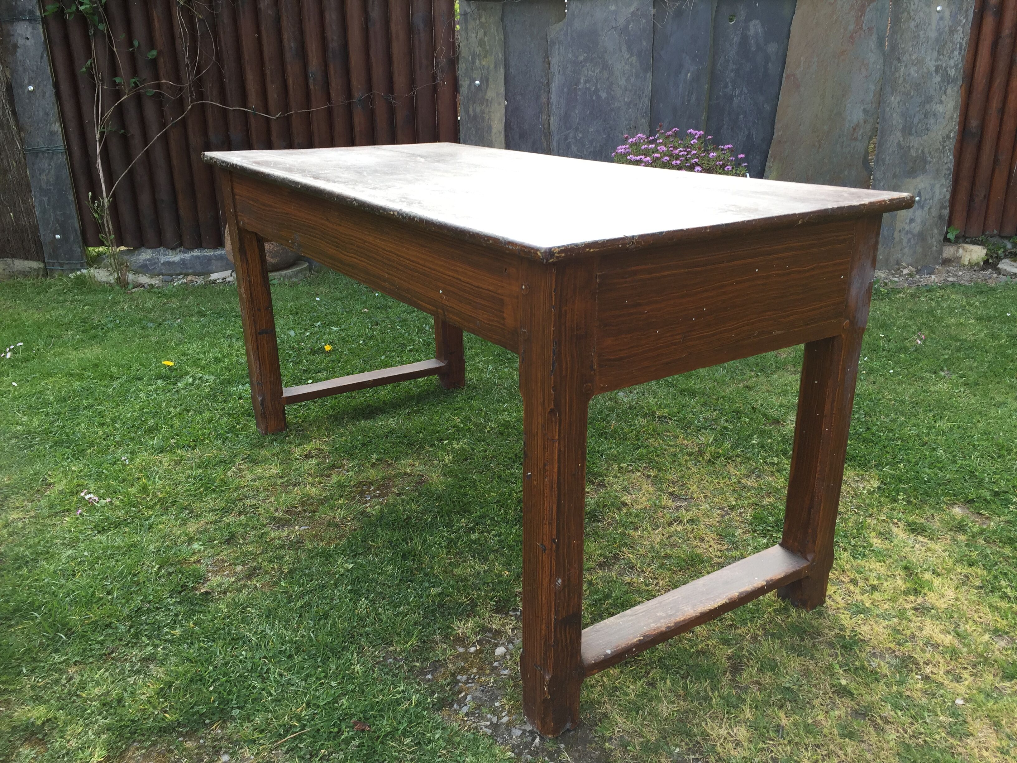 Old farmhouse table in oak painted faux wood old painting.