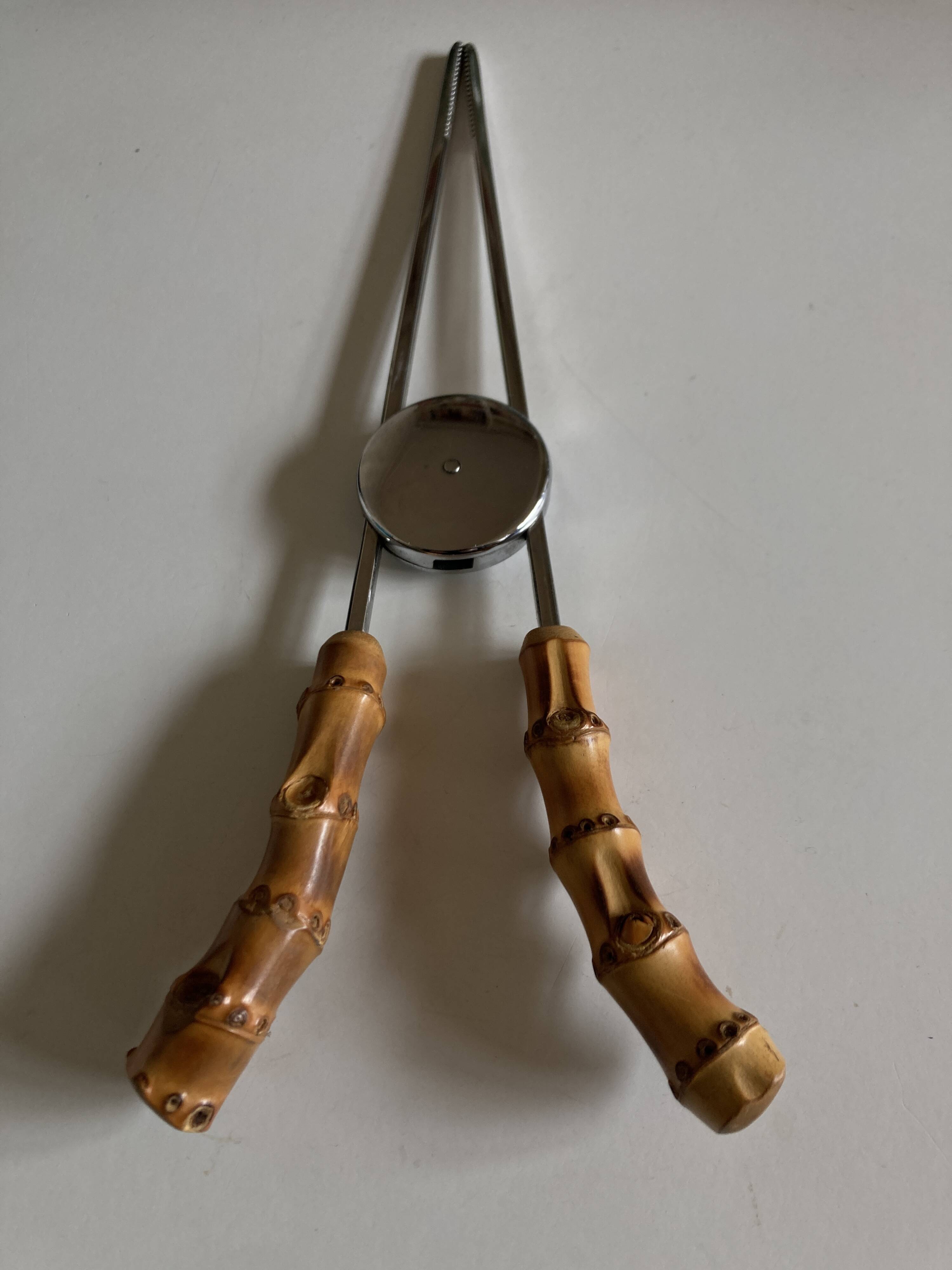 1960 dlg Adnet steel and bamboo ice tongs
