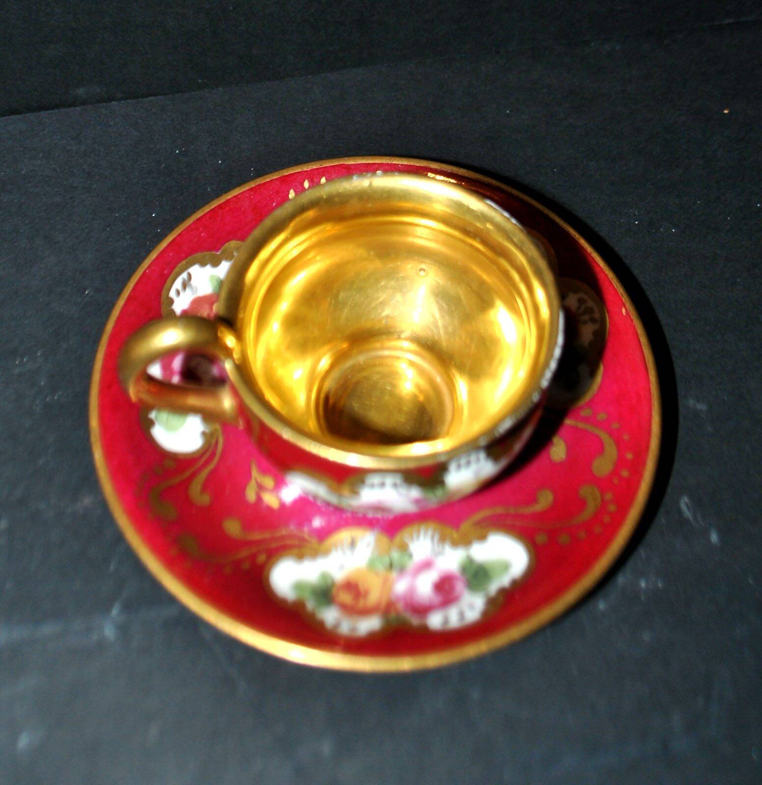 Limoges precious porcelain cup decorated in fuchsia pink and gold, signed MAB