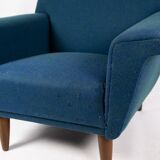 Armchair upholstered with dark blue wool fabric and legs in dark wood, of danish design, 1960s