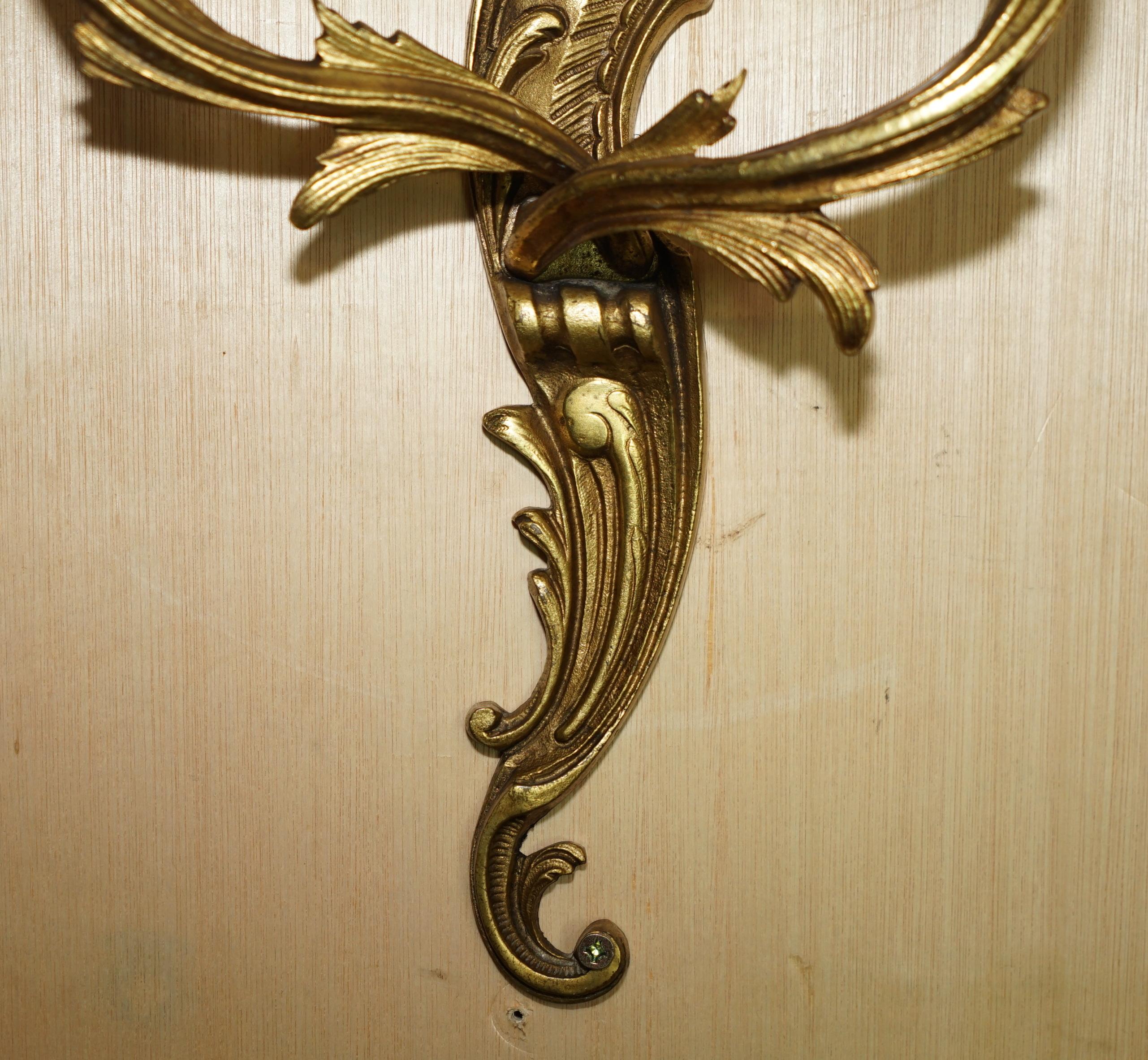 Pair of antique French wall sconces, gilded and bronzed, from the 1920s.