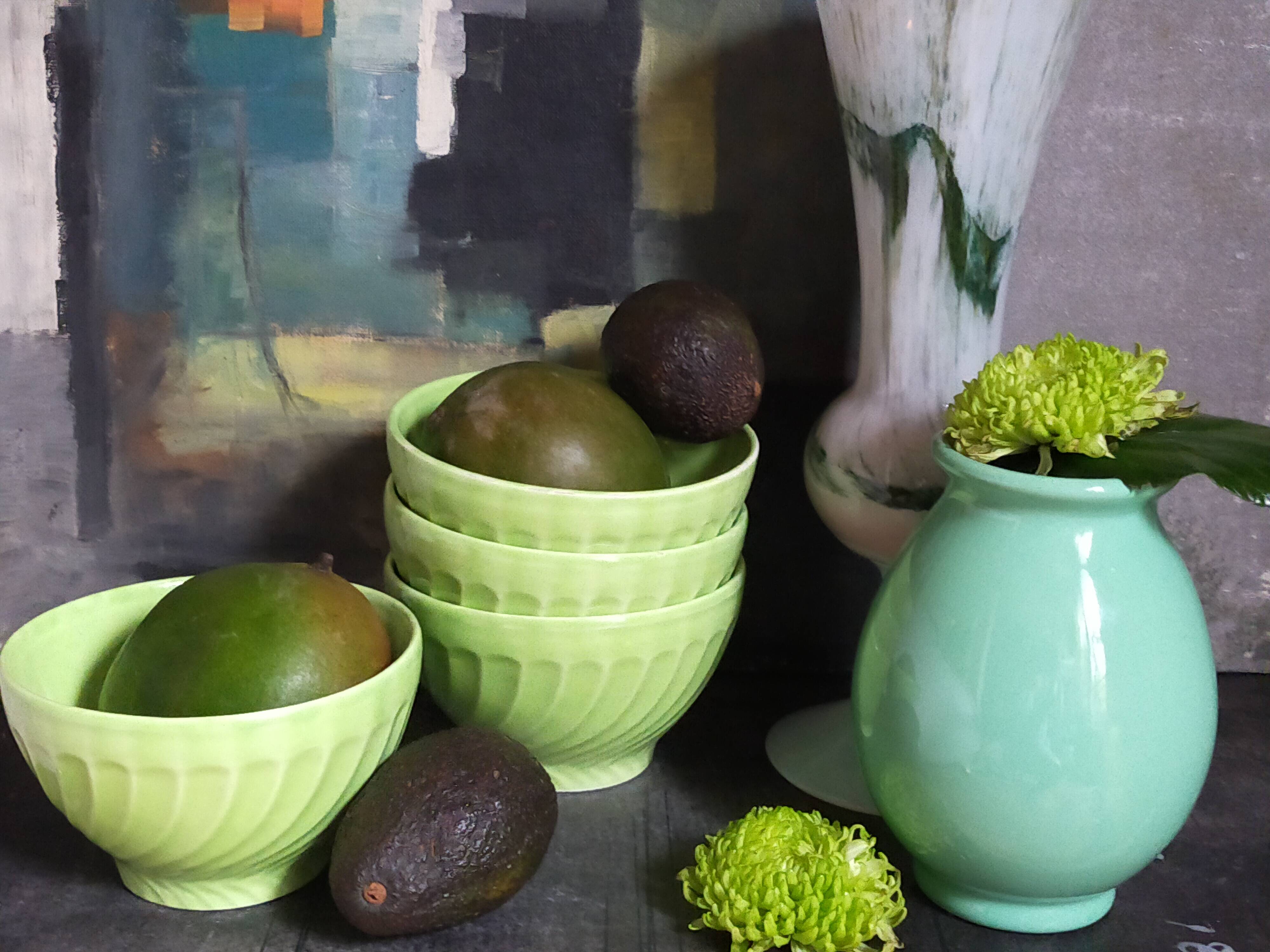 Four vintage spring green earthenware bowls